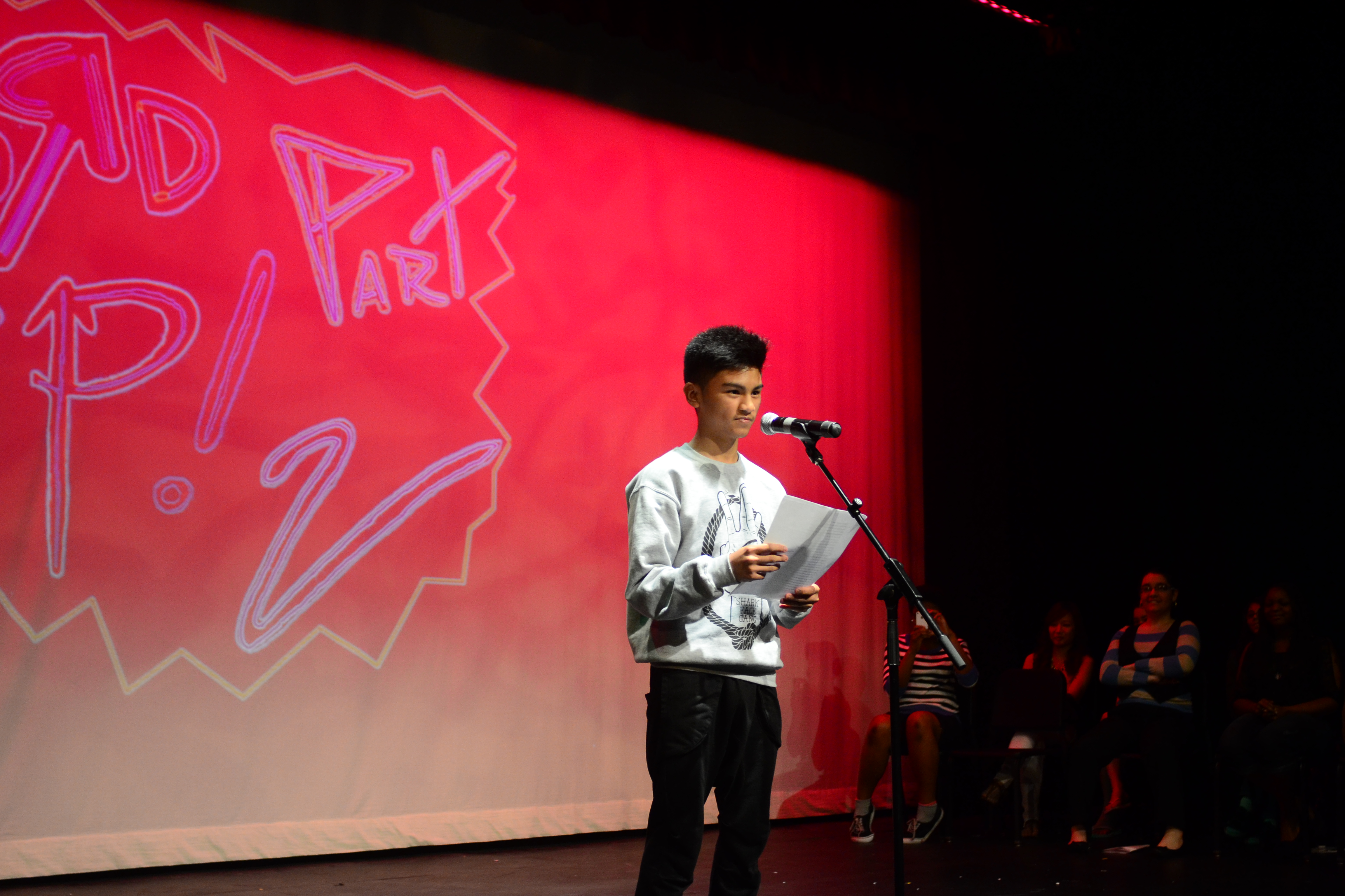 Edsel performing spoken word at Word Up! in the Black Box Theater.